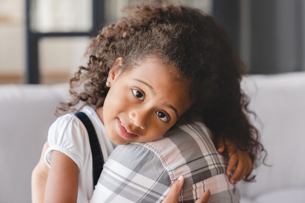 Daughter hugging mom nanny childminder with love and care. Motherhood adoption. Mother`s protection.